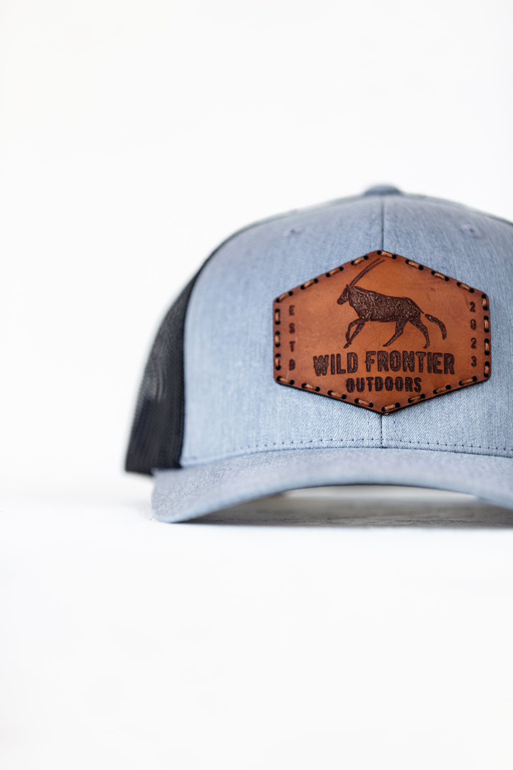 The oryx in Black/Grey trucker with brown thread